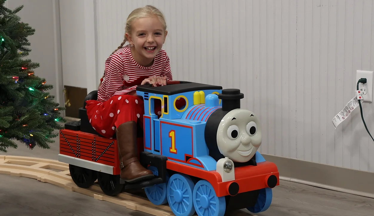 child on Thomas train